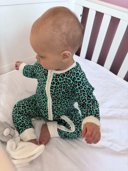 Bamboo zip sleepsuit in forest orchid leopard