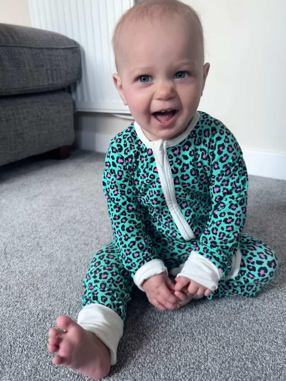 Bamboo zip sleepsuit in forest orchid leopard