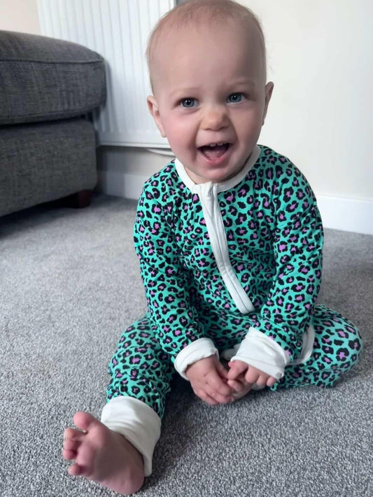 Bamboo zip sleepsuit in forest orchid leopard